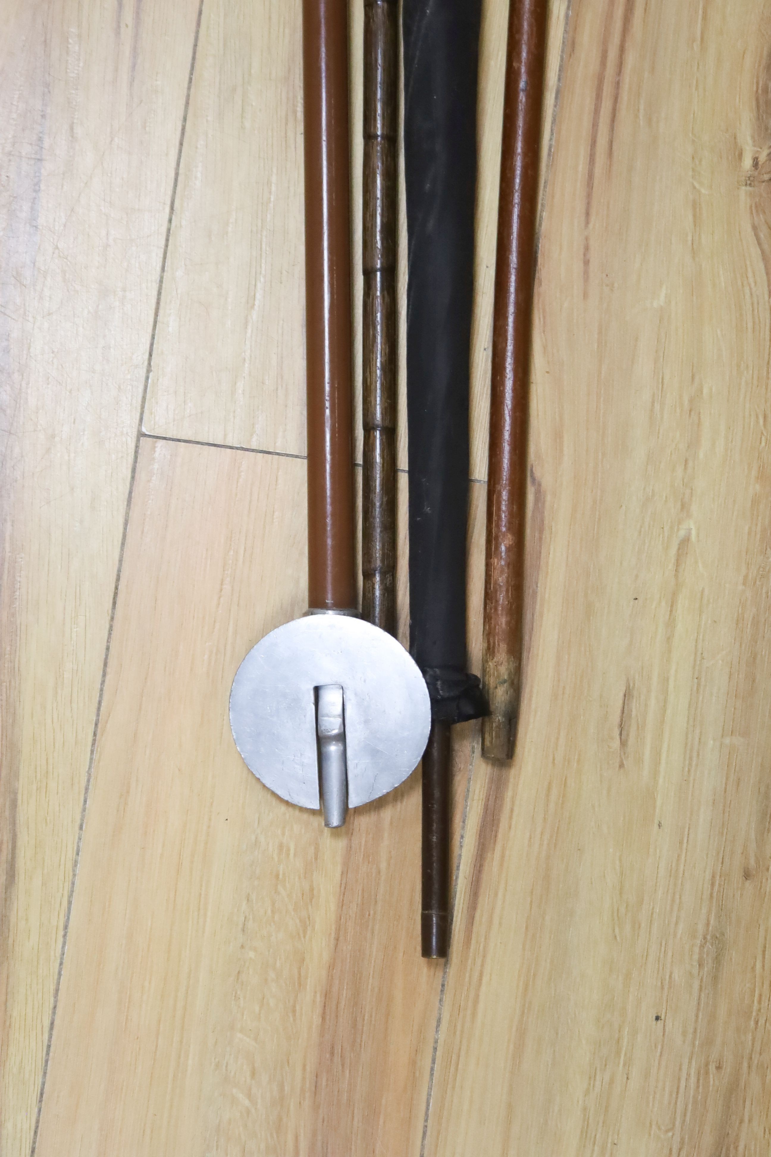 A Victorian 9ct gold mounted walking stick, parasol, silver-mounted stick, etc